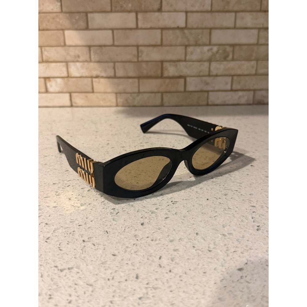 Miu Miu Glimpse SMU 11W Sunglasses Black Oval Gold Logo 54mm 16K-10R